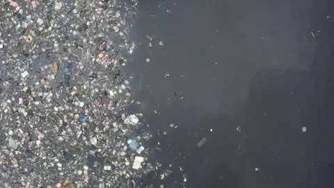 Polluted River with Floating Garbage - Aerial Drone Footage Stock Footage 315080623