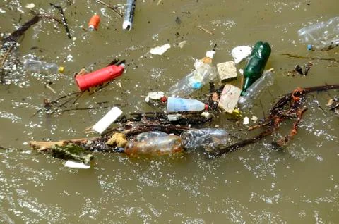 Polluted river with garbage Stock Photos