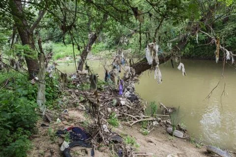 Polluted river, human negligence Stock Photos