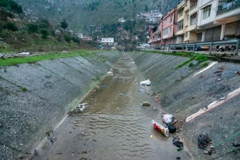 Polluted river from the mountains Stock Photos
