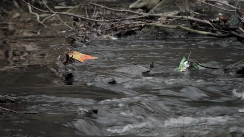 Polluted river in mud with waste and dirty chemical water Stock Footage 120778498