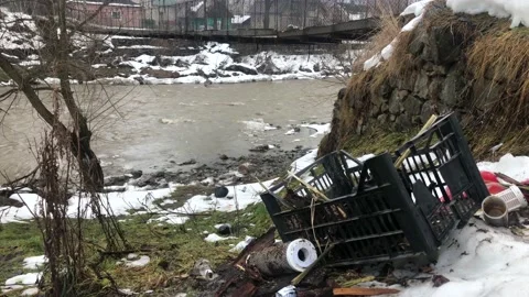 Polluted river. Plastic bottles, bags, trash in river. floating. Vídeos de archivo 168776406