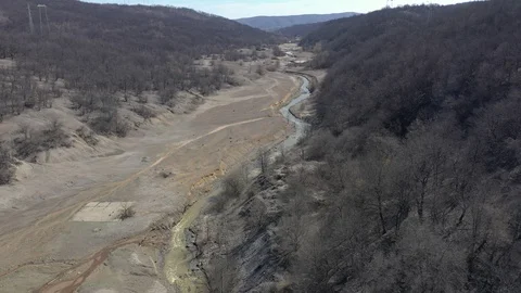 Polluted river stream and coastal area 4K aerial video Stock Footage 107702910