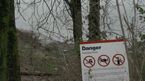 Polluted River Warning Sign - tilt down Stock Footage 22581637