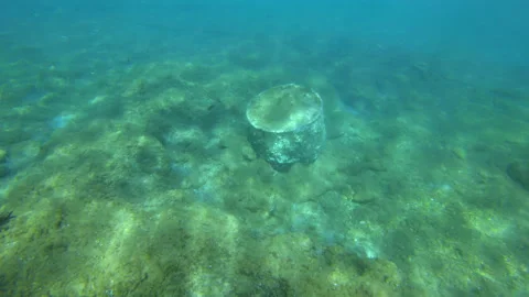 Polluted sea and ocean. An old metal can in the Mediterranean Sea in Greece. Video stock 229896130