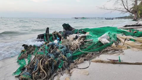 Polluted Shoreline, Abandoned Nets and Marine Trash Stock Footage 263336643