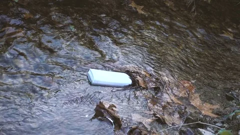 Polluted stream with a plastic bottle Video stock 71377187