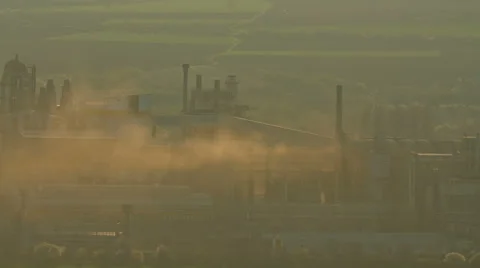 Polluting factory at dawn, time lapse. Stock Footage 61354107