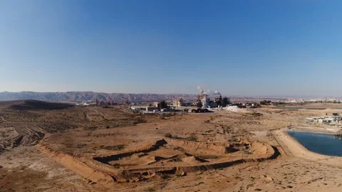 Polluting plant in the desert Stock Footage 99830154