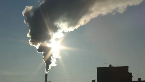 Polluting the thick smoke from the chimney closes sunlight Stock Footage 10719436