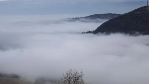 Pollution and clouds around mountains timelapse from above Stock Footage 264051953