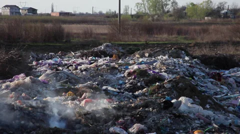 Pollution from burning trash at garbage dump landfill  Stock Footage 36778915