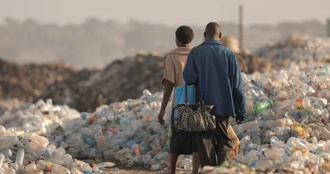 Pollution concept. Garbage pile in a trash dump in a Landfill, Zambia Lusaka Stock Footage 128194954