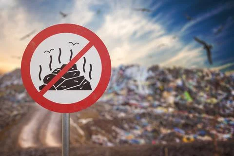 Pollution concept. Garbage pile in trash dump or landfill. Birds Stock Photos