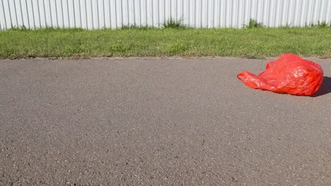 Pollution concept. Plastic bag, flying in the wind in the street. Stock Footage 118085277