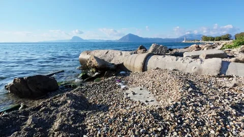 Pollution from drainage pipe spoiling natural coastal landscape Stock Footage 308935126