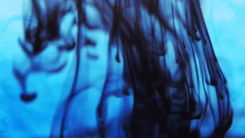Pollution of the environment. Black ink flowing up and swirling under blue color Stock Footage 158054644