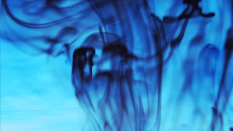 Pollution of the environment. Black ink flowing up and swirling under blue color Stock Footage 158054668