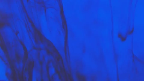 Pollution of the environment. Black ink flowing up and swirling under blue color Stock Footage 158857069