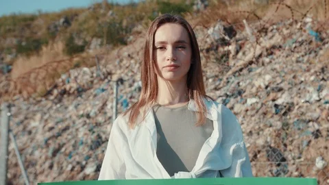 Pollution environmental problem. Outdoor portrait of girl activist holding Save Stock Footage 113797677