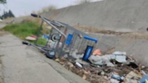 Pollution Grunge Trash Waste Garbage in Ditch Wash Environment California USA Stock Footage 155207208