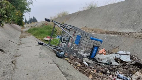 Pollution Grunge Trash Waste Garbage in Ditch Wash Environment California USA Stock-Footage 155211844