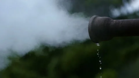 Pollution pipe drain letting out steam exhaust Stock-Footage 52502123