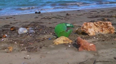 Pollution - Plastic Trash Garbage Rubbish bags left on beach 2 Video stock 7765197