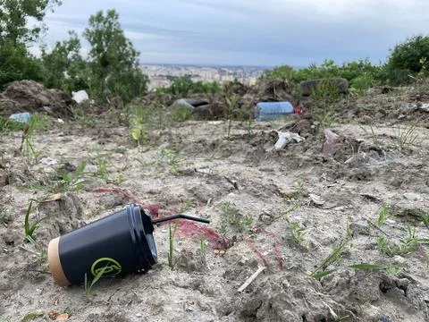 Pollution problem A lot of trash on the field 库存照片