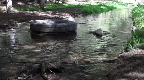 Pollution in the river water  contaminated by plastic garbage Stock-Footage 67728543