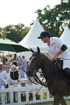 A polo player in front of audience Stock Photos