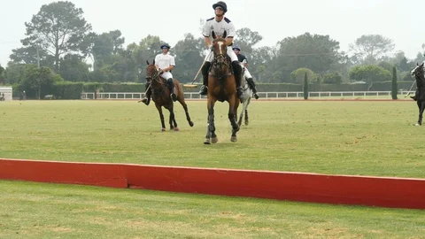 Polo player knocks ball out of bounds 스톡 동영상 115093893