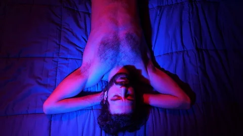 Polyamory,polygamy,threesome. One man and two women kissing in bed 스톡 동영상 103612065