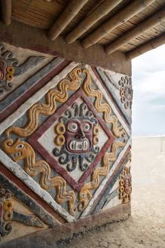 Polychrome relief mural of the Moche deity Aiapaec with serpent motifs on an ado Stock Photos