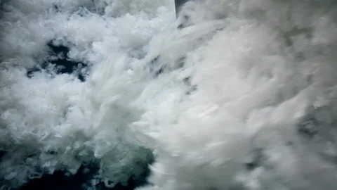 Polyester batting falling from a factory conveyor. 库存影片 111657205