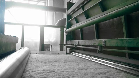 Polyester batting rolled on a factory conveyor. Stock Footage 107907327