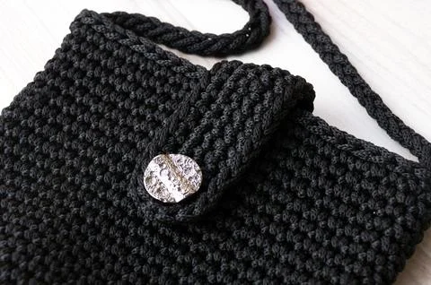 Polyester yarn. A small black handbag for the summer. Foto stock