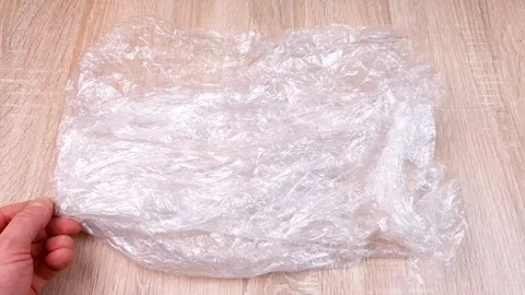 Polyethylene, plastic. Crumpled plastic bag, packaging, wrapping. Stock Footage 293686265