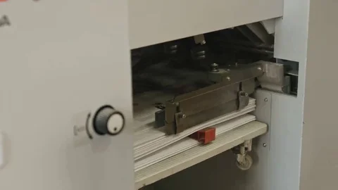 Polygraph process inside - folding machine on printing industry - the sheets of Stock Footage 69127363