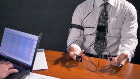 Polygraph screen and a test subject answering questions. 4K 60 fps. Stock Footage 76747730