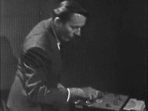 A polygraph technician explains to a guilty jewelry store employee that he has Stock Footage 75297333