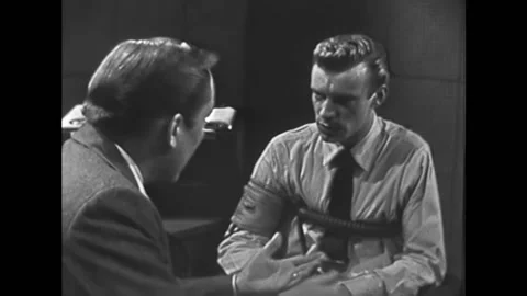 A polygraph technician explains the interrogation process to a jewelry store Stock Footage 157264122