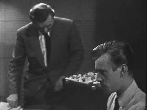 A polygraph technician interrogates and monitors a polygraph test of a jewelry Stock Footage 75297319