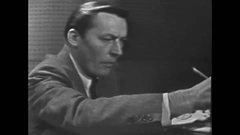 A polygraph technician performs a playing card during the polygraph of a guilty Stock Footage 157214729