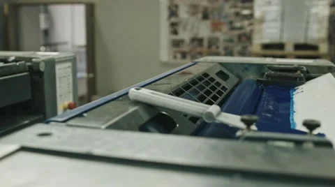 Polygraphy printing industry - blue paint on ink roller, close up Stock Footage 68385662