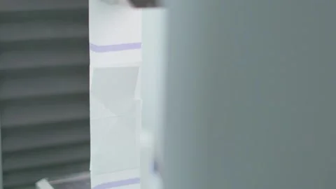 Polymer tape is installed to strength test machine in slow motion Stock Footage 202062209