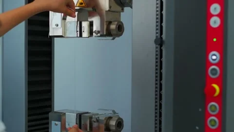 Polymer thread for plastic sack bags is installed to strength test machine Stock Footage 202072682