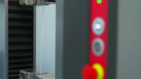 Polymer thread for plastic sack bags is tested for strength in laboratory Stock Footage 202076050