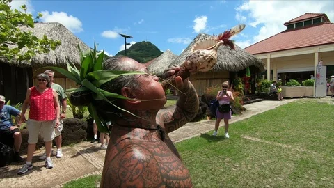 Polynesian man blowing conch shell, Uturoa, Raiatea, French Polynesia Stock Footage 114358697