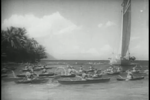 Polynesian men in canoes rowing towards yacht 스톡 동영상 11349677